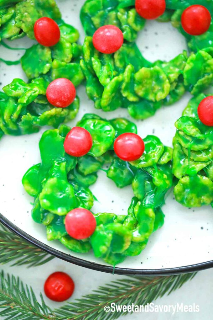 green wreath cookies with red candies