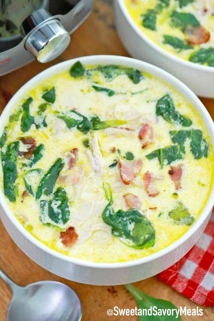 bowl of creamy chicken soup with spinach