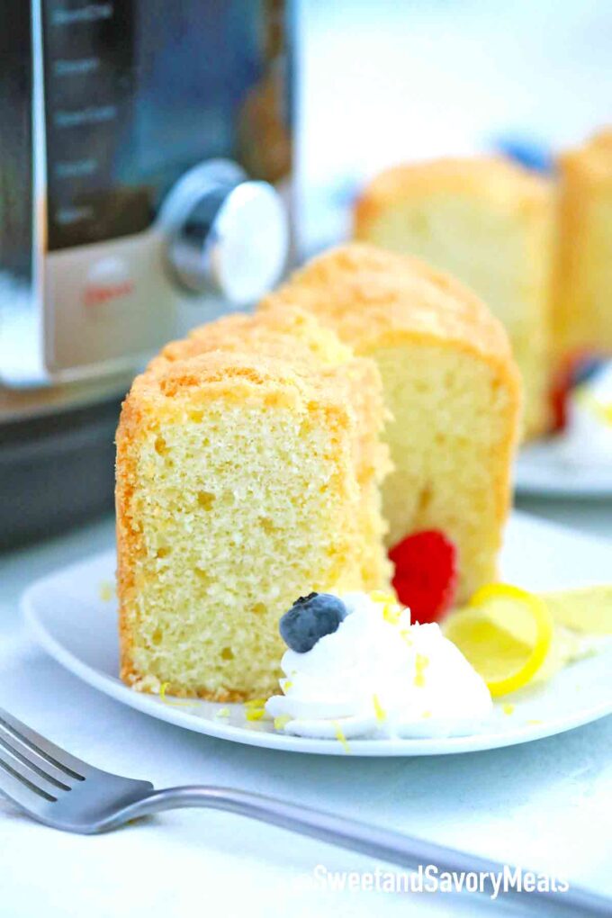sliced pound cake with whipped cream and berries