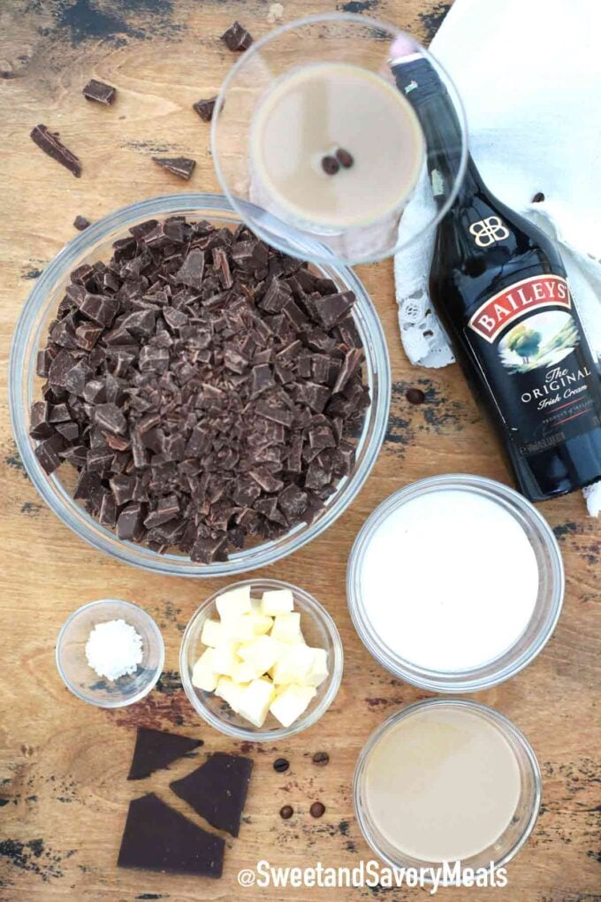 ingredients in bowls on a table and a bottle of baileys
