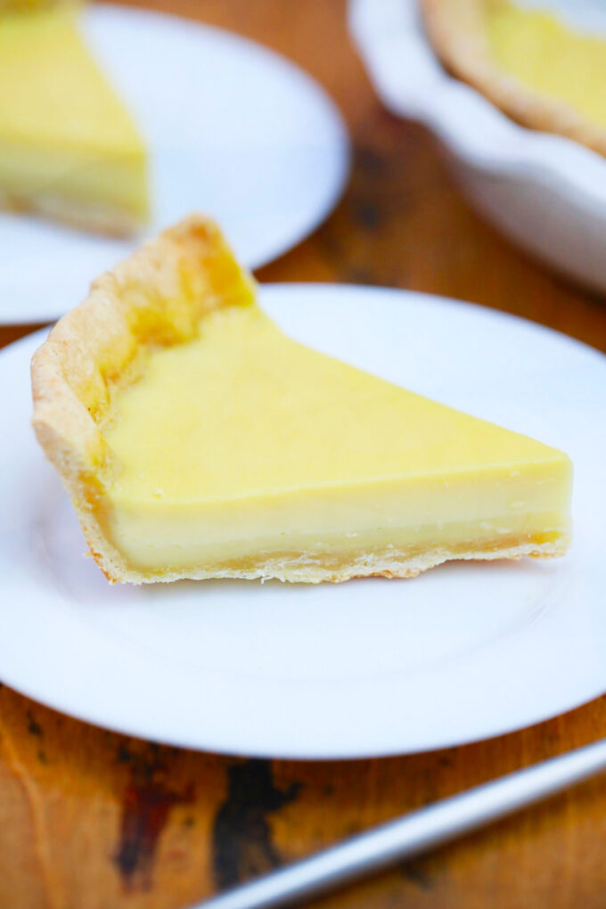 A slice of homemade Amish custard pie with homemade pie crust.
