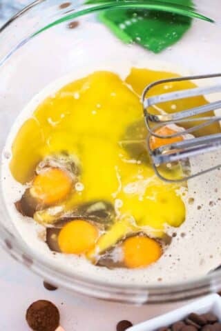 adding eggs to a beer batter mix