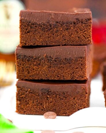 three fudgy guinness chocolate brownies stacked on top of each other
