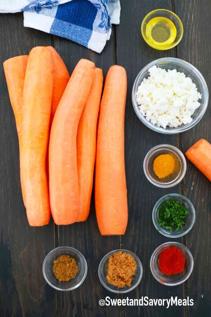 carrots and spices on. wooden table