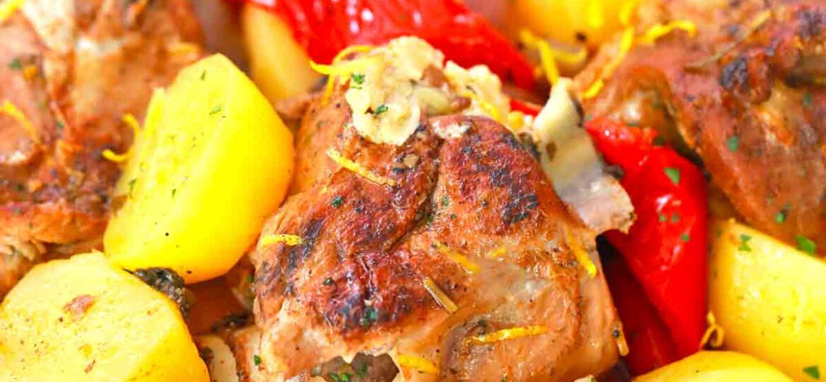 a bowl of roasted lamb with potatoes and bell pepper