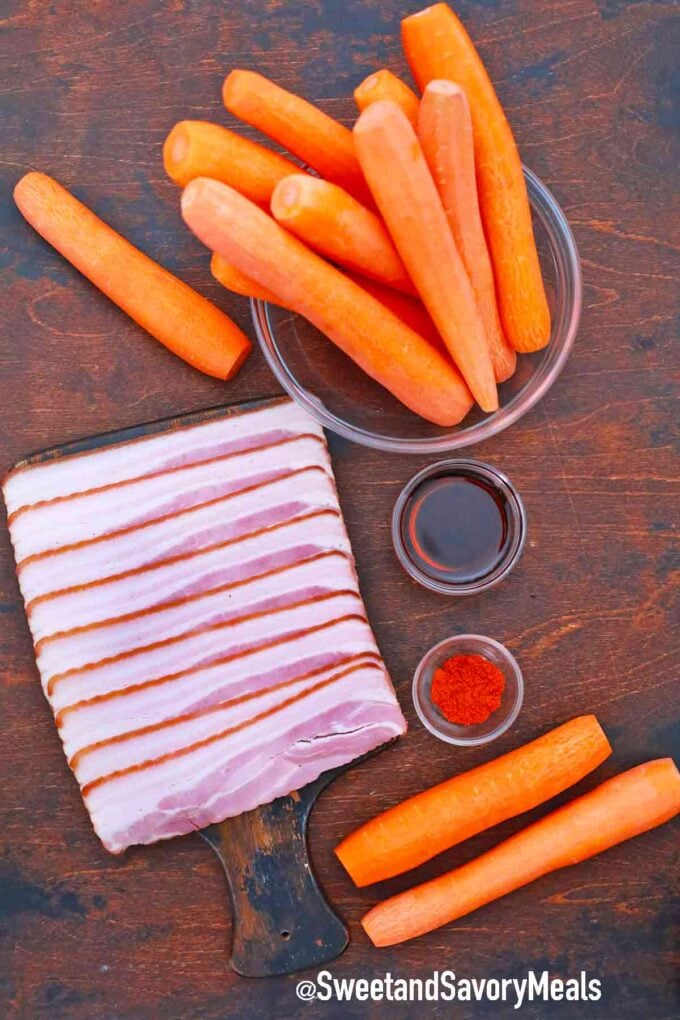 carrots and bacon on a wooden table