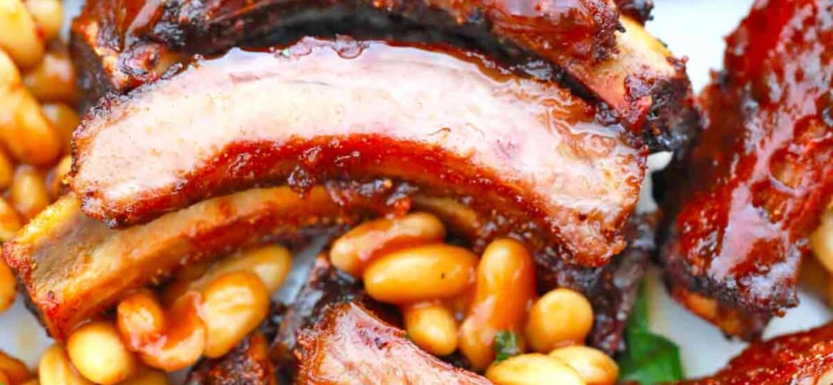 bbq pork ribs and baked beans on a plate