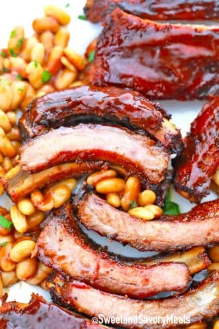 bbq pork ribs and baked beans on a plate