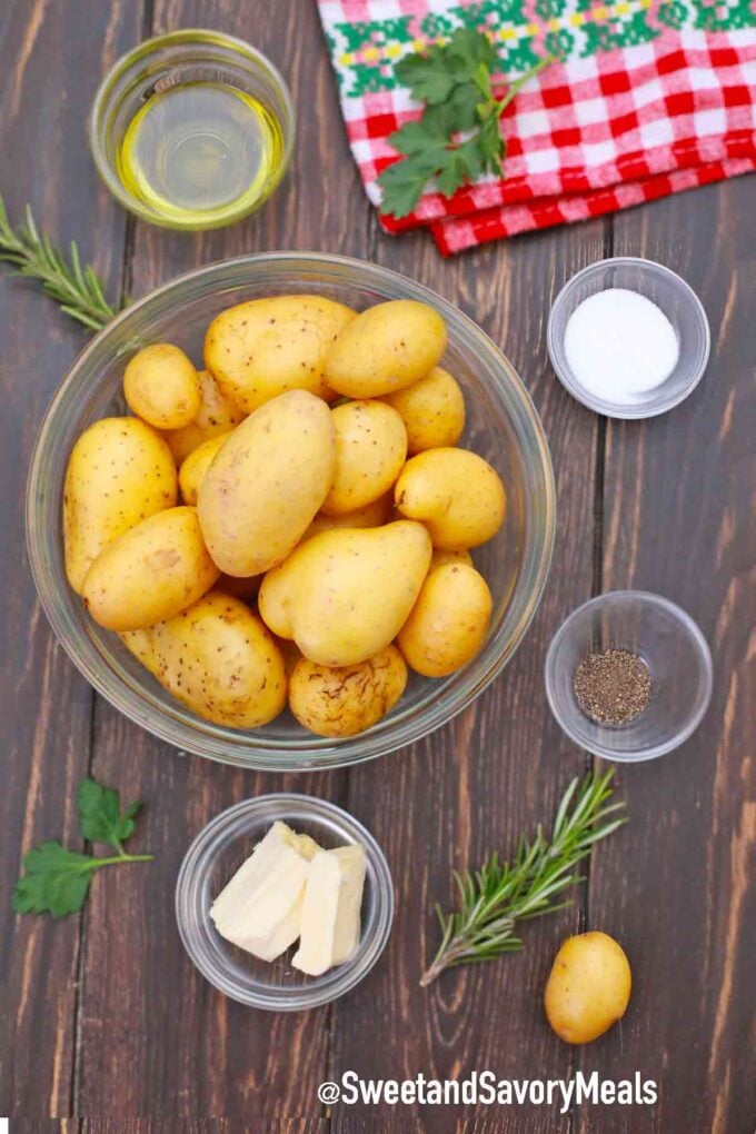 potatoes and ingredients in bowls in a wooden table