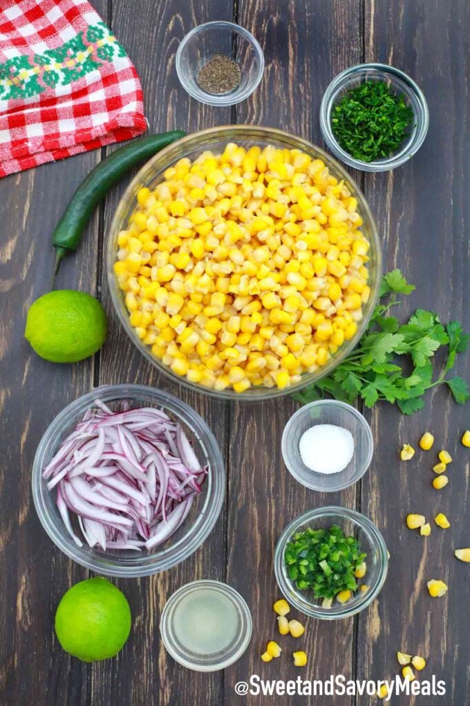 corn and other ingredients in bowls on a wooden table