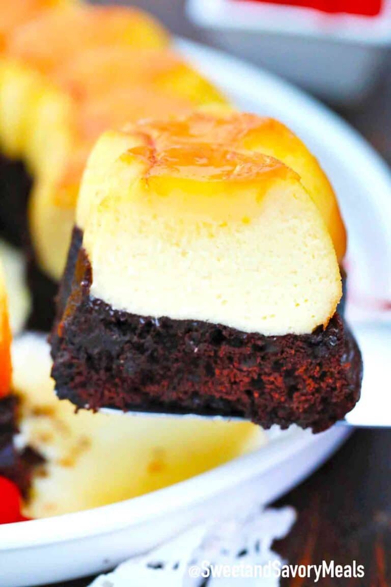 slicing chocolate flan with a layer of chocolate cake