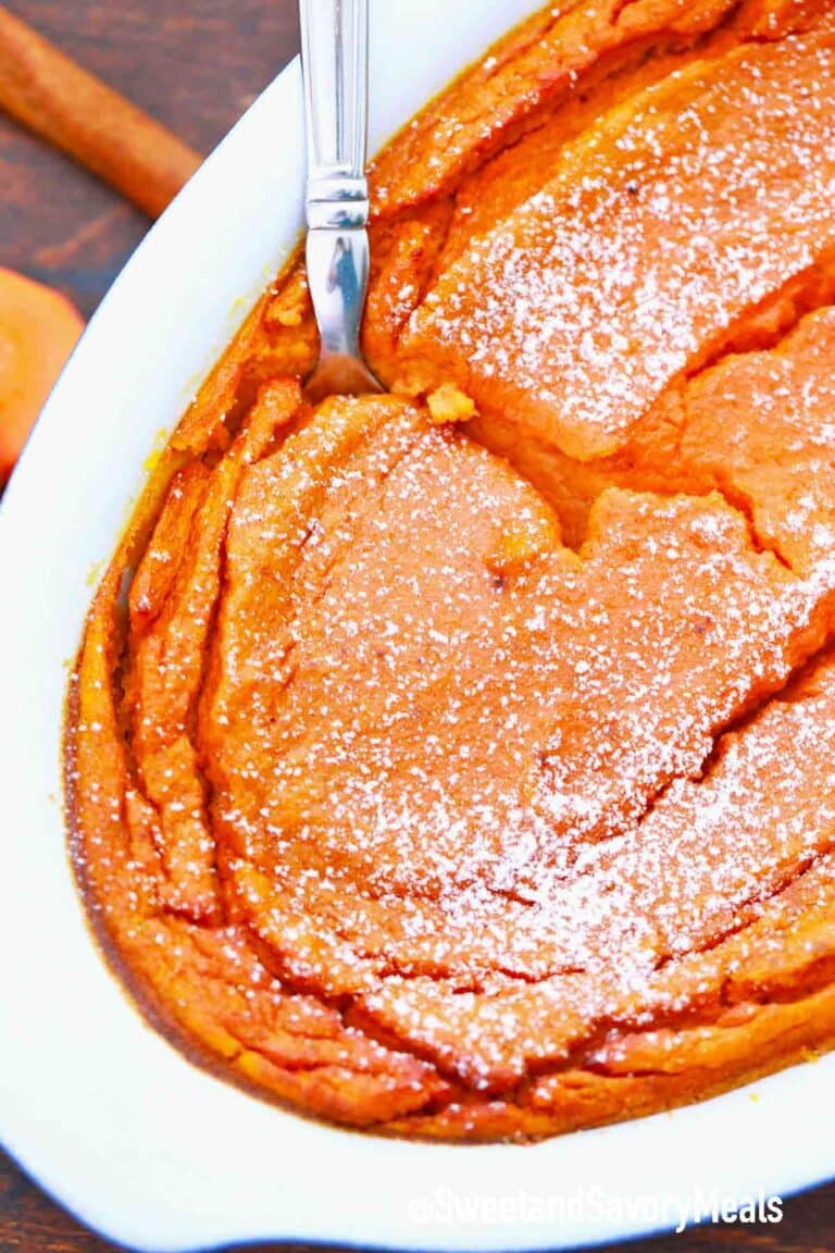 the side of a casserole dish with carrot souffle