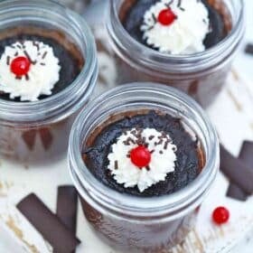 chocolate pots de crème topped with whipped cream