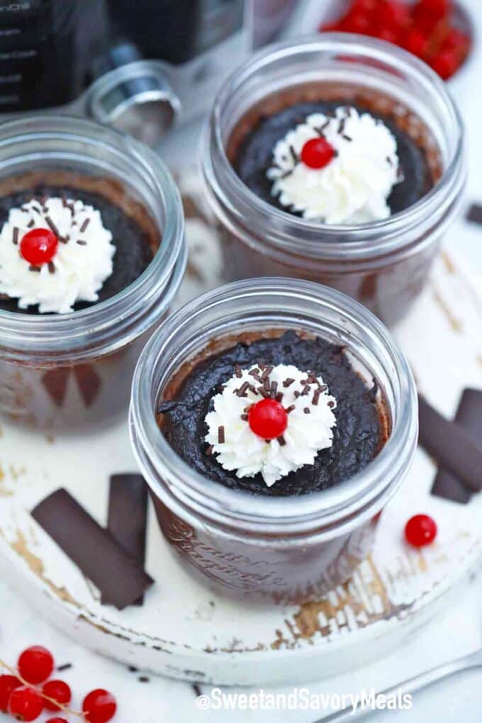 chocolate pots de crème topped with whipped cream