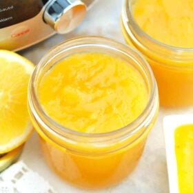 mason jars with lemon curd next to an instant pot