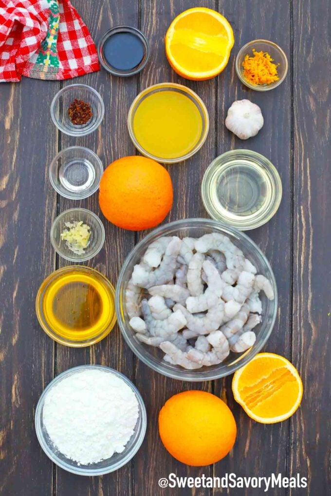 oranges and ingredients in bowls on a table