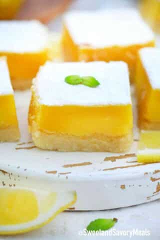 lemon squares on q white cutting board