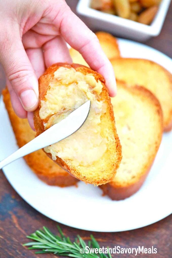 garlic confit spread on a slice of bread