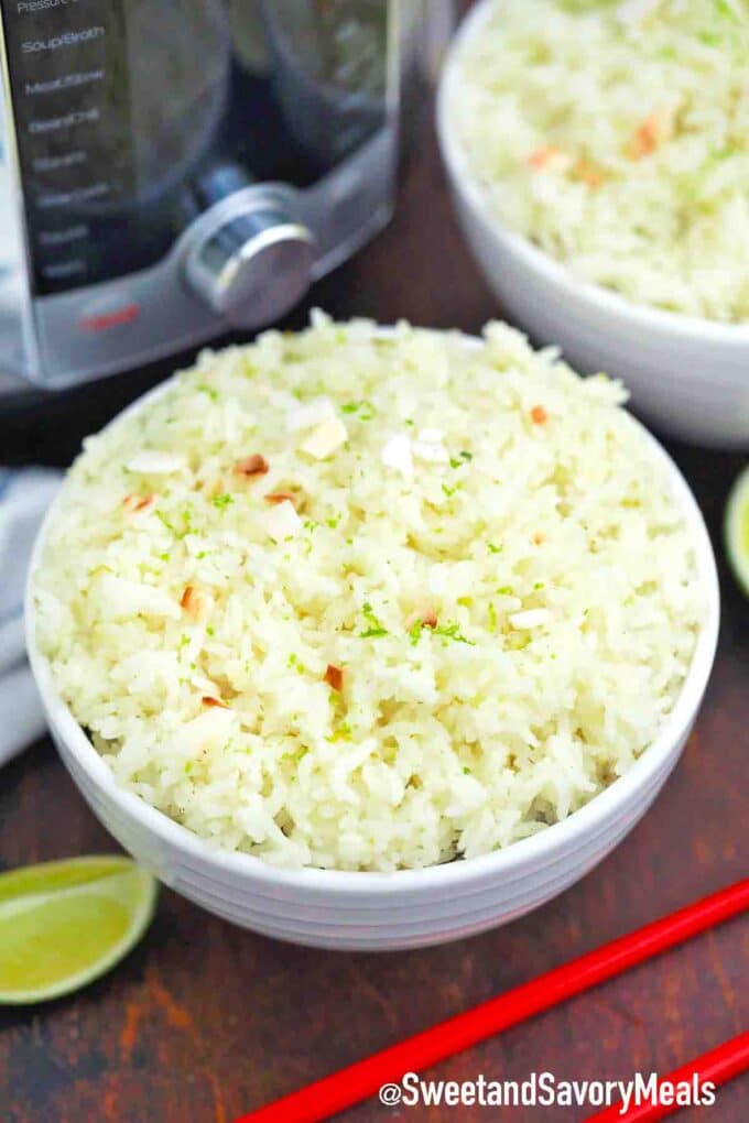 bowl of instant pot coconut rice topped with toasted coconut
