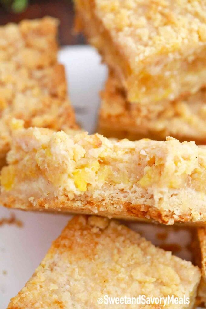 a pineapple crumb bars with a bite