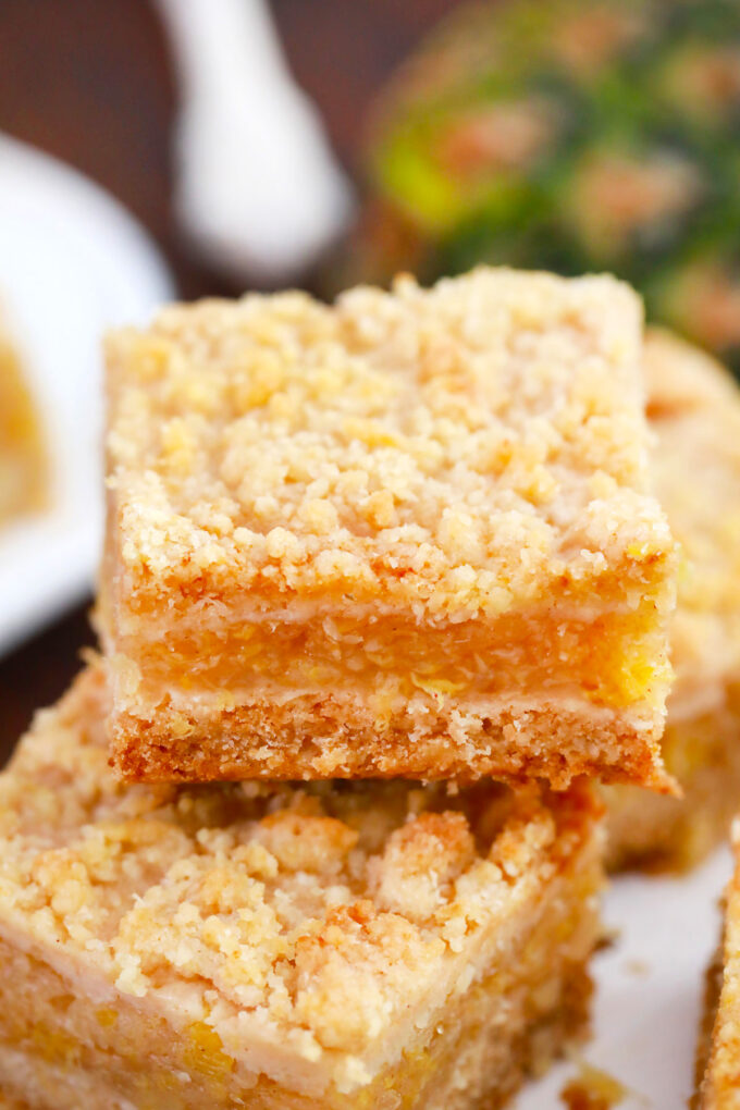 Buttery pineapple crumb bars with a crumb topping.