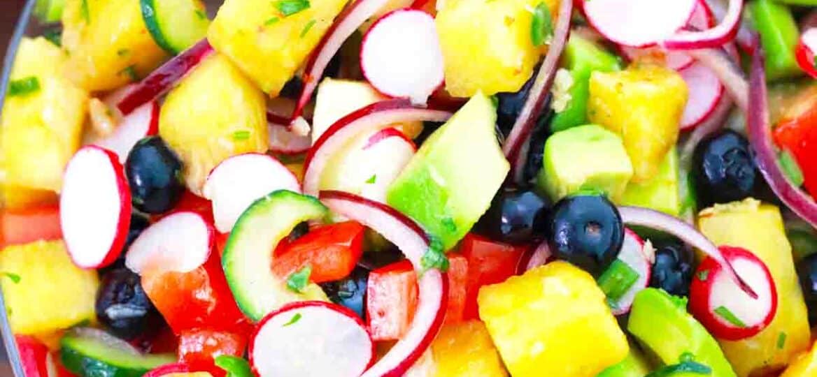 overhead shot of a large bowl of pineapple cucumber salad