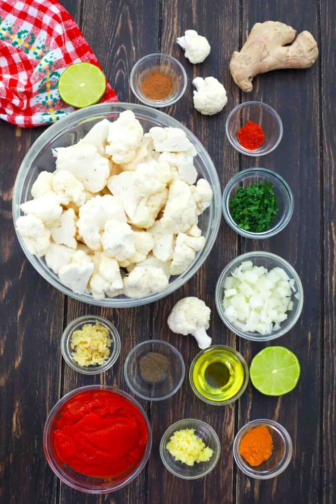 cauliflower and other ingredients in bowls on a table