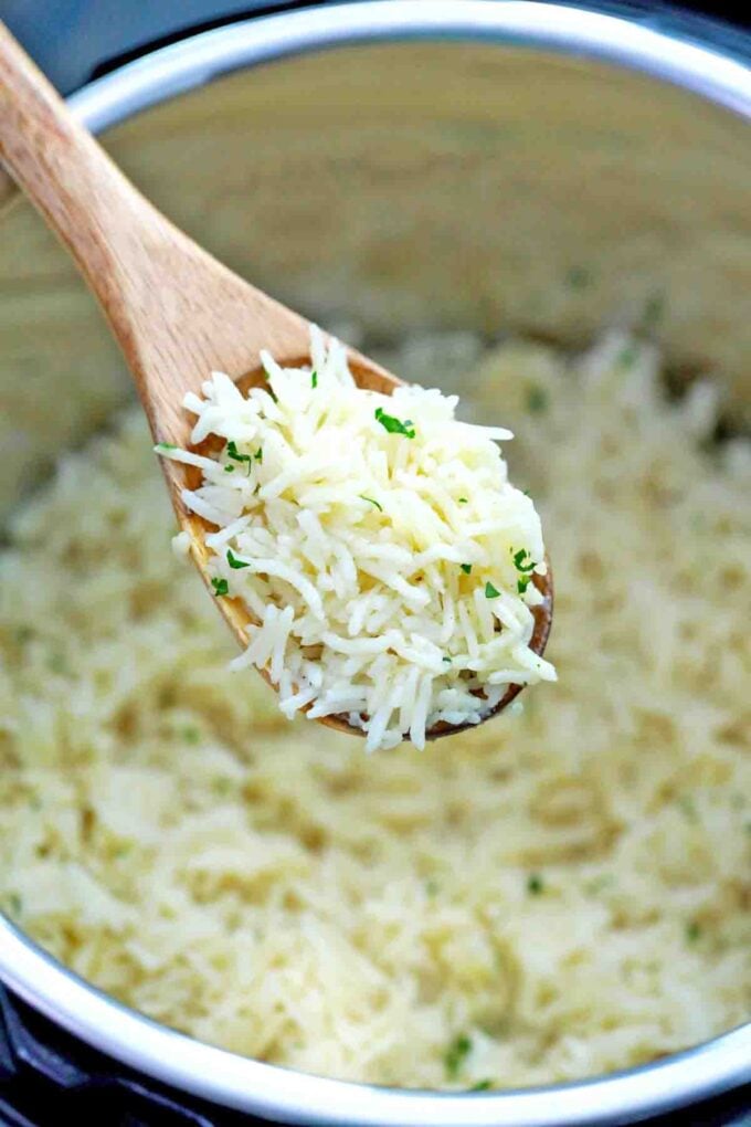 a spoonful of fluffy instant pot stick of butter rice