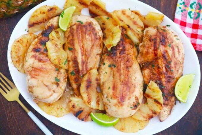 grilled pineapple chicken with lime on a serving plate