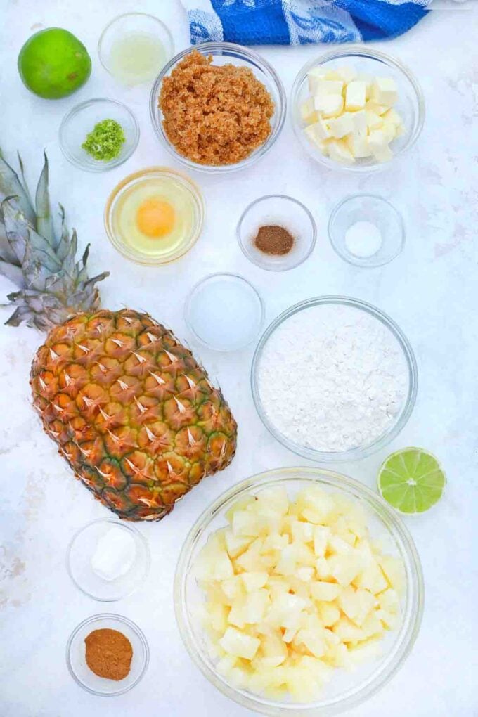 pineapple and other ingredients in bowls on a table