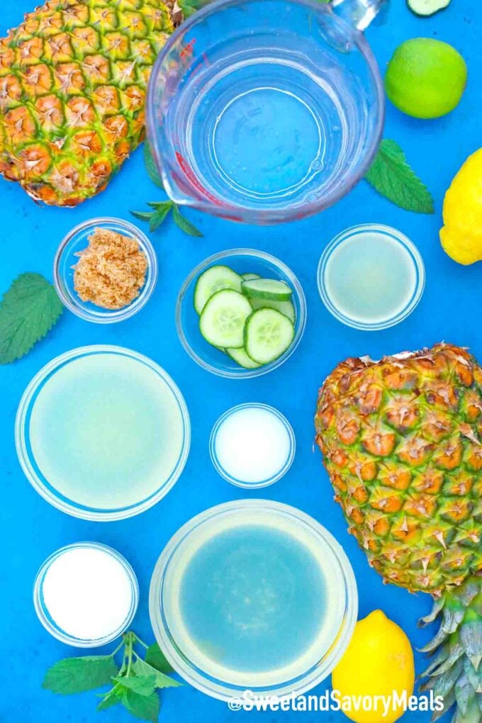 fresh pineapple and other ingredients on a blue table