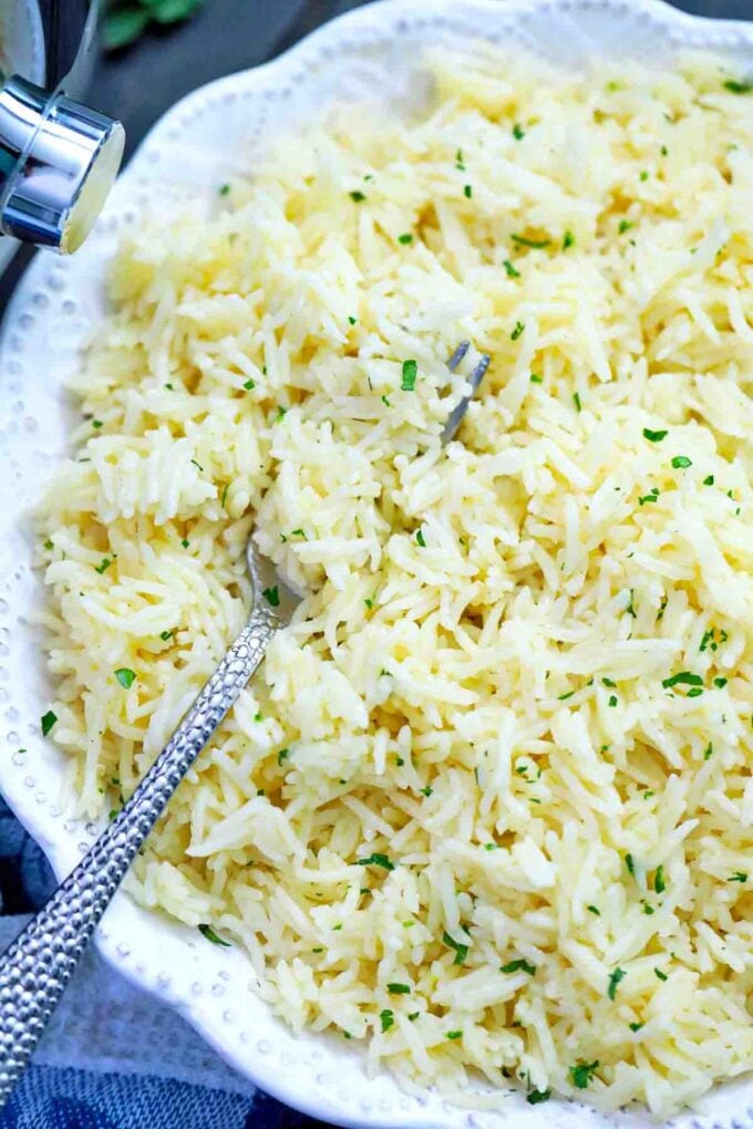buttery fluffy instant pot stick of butter rice in a bowl