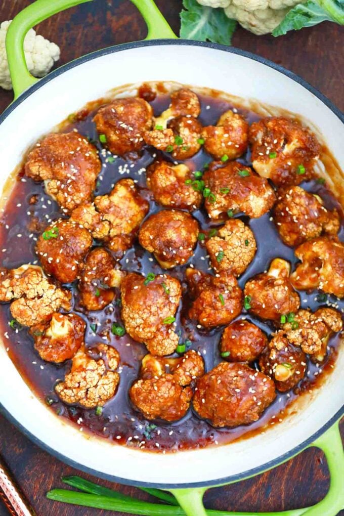 overhead shot of a pan with asian sticky sesame cauliflower in a sticky sauce