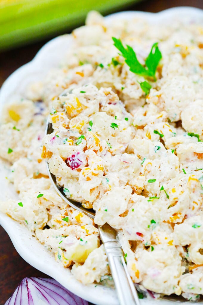 A spoonful of creamy Mexican street corn pasta salad.