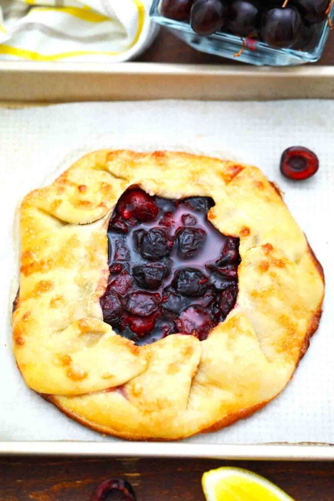 cherry galette on a baking sheet