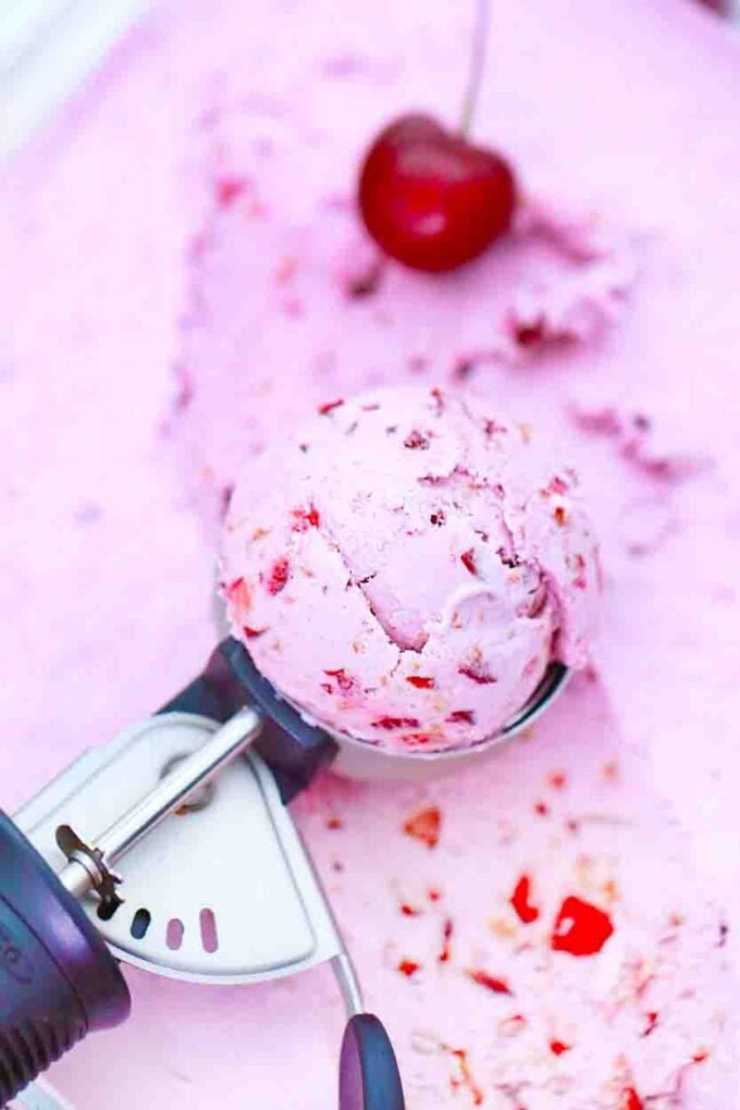 a scoop of pink cherry ice cream