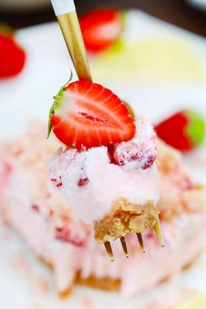 A forkful of strawberry dream dessert.