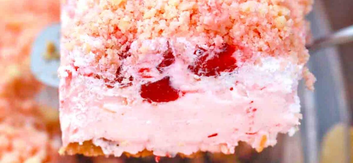 a slice of strawberry dream dessert on a serving spatula