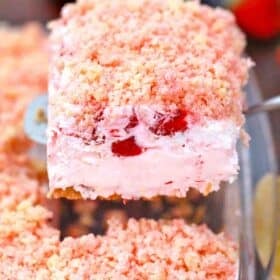a slice of strawberry dream dessert on a serving spatula