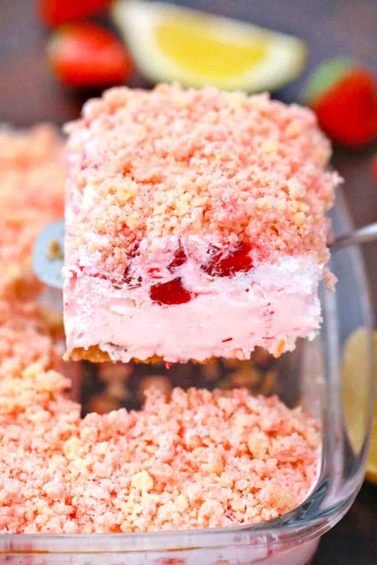 a slice of strawberry dream dessert on a serving spatula