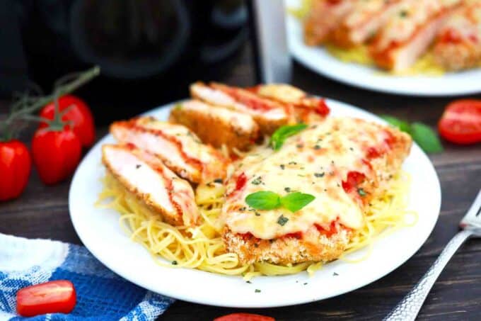 air fryer chicken parmesan on top of spaghetti