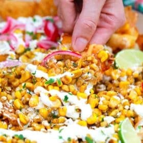 scooping mexican street corn nachos