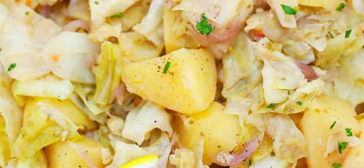 overhead shot of a bowl with cabbage and potatoes