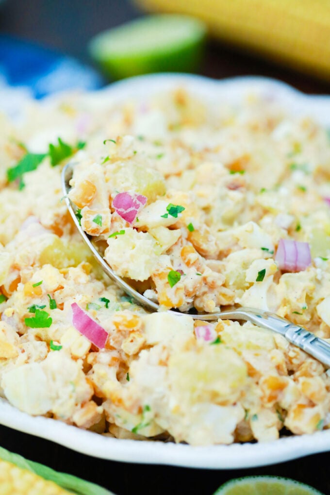 A spoonful of Mexican street corn potato salad.