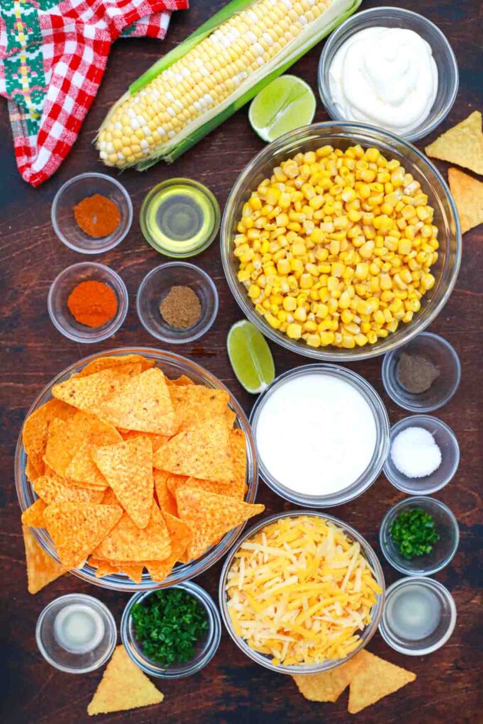 overhead shot corn chips cheese corn mayo sour cream in bowls