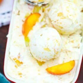 overhead shot of a dish filled with peaches and cream ice cream