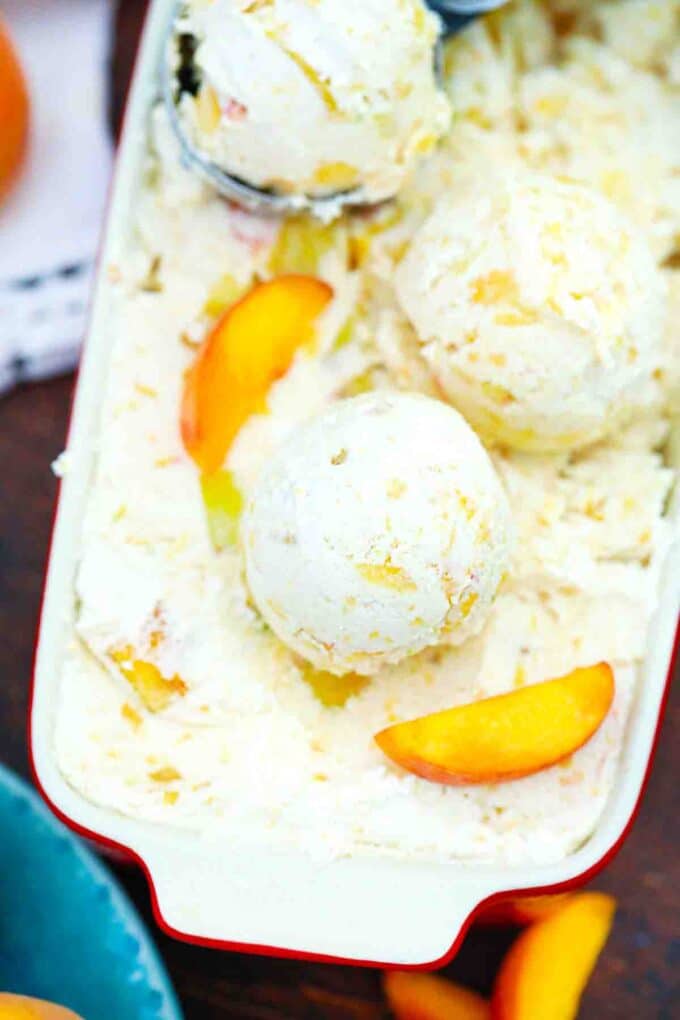 overhead shot of a dish filled with peaches and cream ice cream