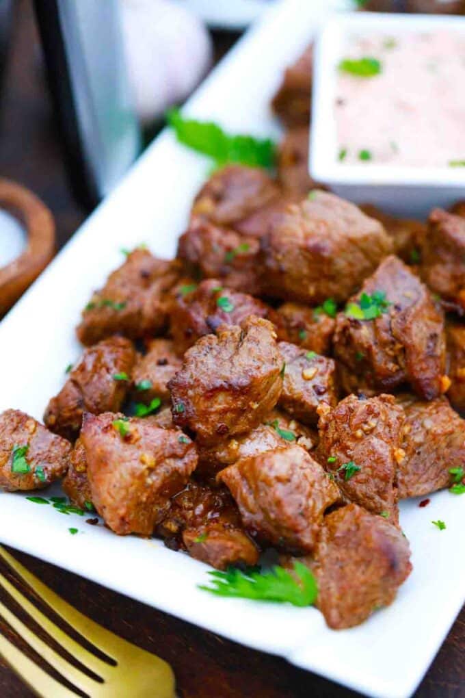 a plate of juicy air fried steak bites