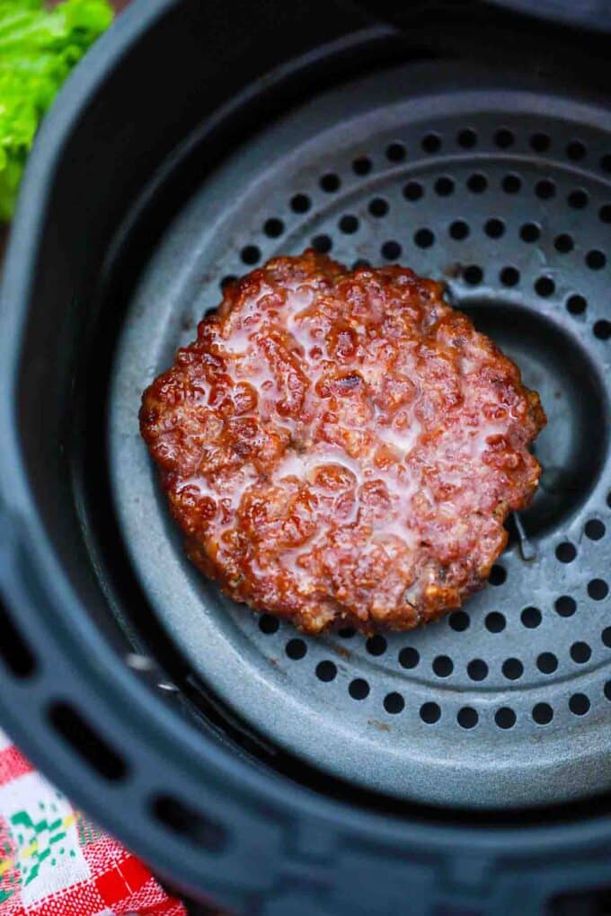 overhead shot of a beef patty in the air fryer