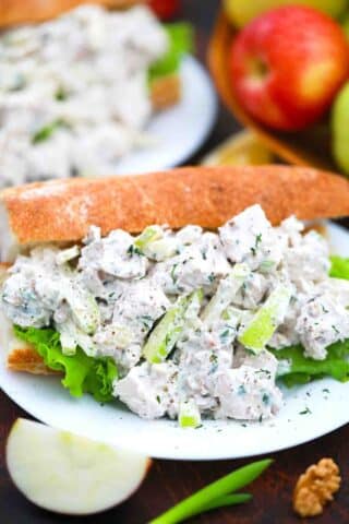 side shot of an overstuffed apple fennel chicken salad sandwich